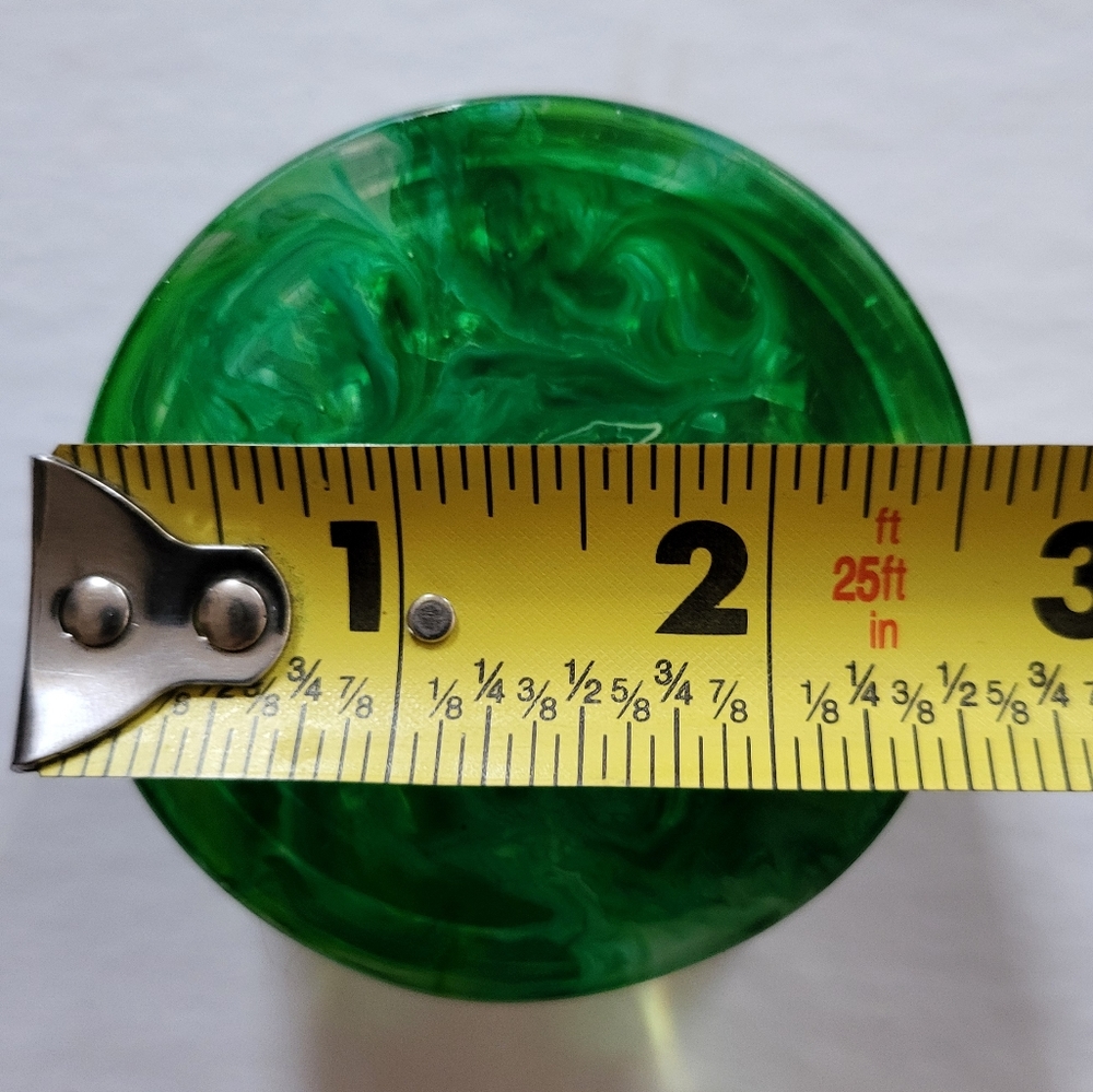 Green handmade epoxy resin grinder. Custom and unique coloring